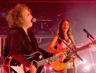 Olivia Rodrigo and Robert Smith during the main main glastor expensive